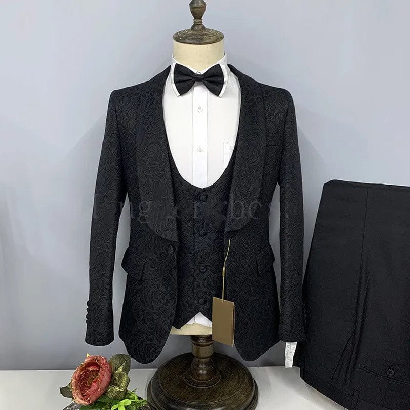 Black men's 3-piece wedding tuxedo with shawl lapel, slim fit, shown with jacket, pants, vest, and tie for formal groom or groomsmen attire.