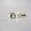 Huitan women's olive green zircon wedding ring with gold leaf band, elegant and trendy jewelry for women.