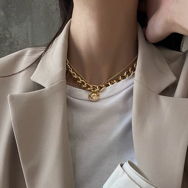 Beautiful view of a woman wearing a Showlu Fashion thick alloy cross chain necklace, trendy hip hop style accessory.