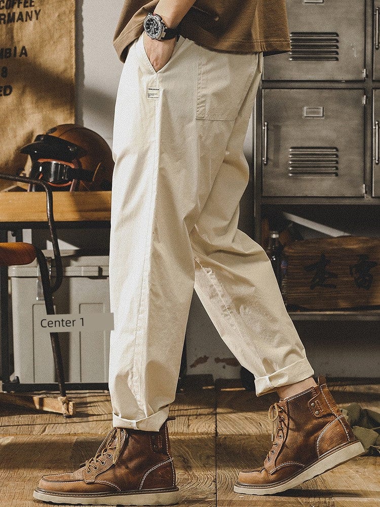 Light gray Jereno Ice Silk Cotton tapered pants from Showlu Fashion Store, featuring a minimalist design and quick-dry fabric.
