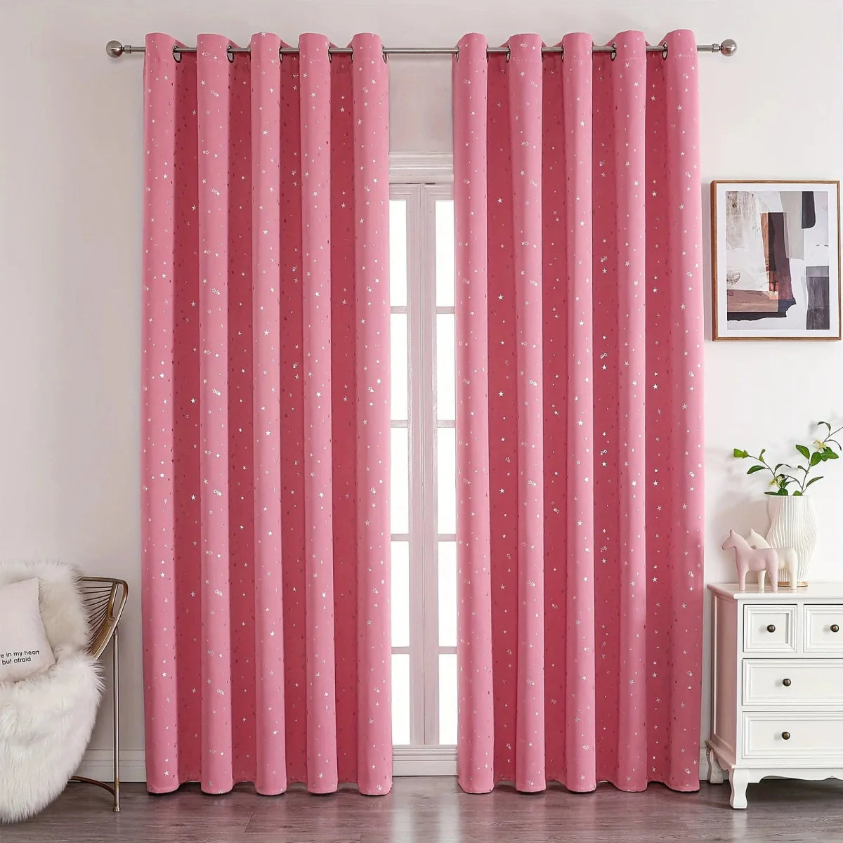 Blackout kids' curtains with star pattern and grommet top, ideal for bedroom or living room window decor.
