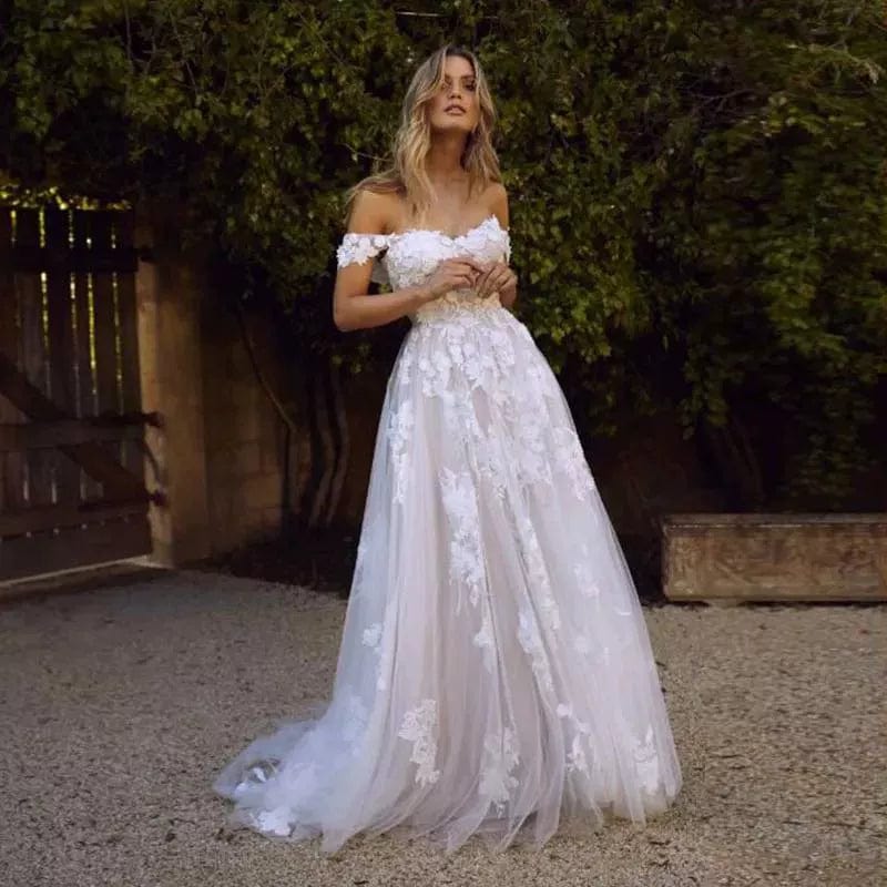 Off-shoulder lace wedding gown by Showlu Fashion, elegant bridal dress with intricate lace details and a flowing skirt.