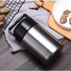 A silver stainless steel vacuum insulated food container with a black lid and carrying handle.
