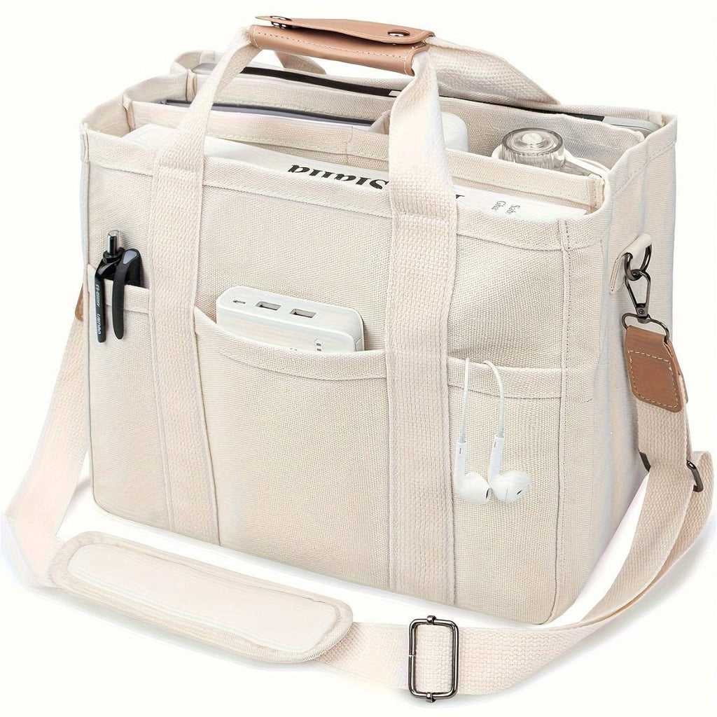 Showlu large beige canvas shoulder bag with multiple pockets and a wristlet, featuring durable handles and versatile design.