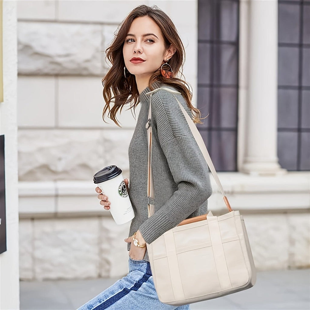Showlu beige large canvas multi-pocket shoulder bag with compartments and durable handles, includes a wristlet for versatile carrying.