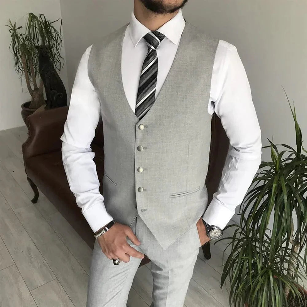 Light gray 3-piece men's suit with notch lapel, slim fit, includes blazer, vest, and pants, suitable for formal and wedding occasions.