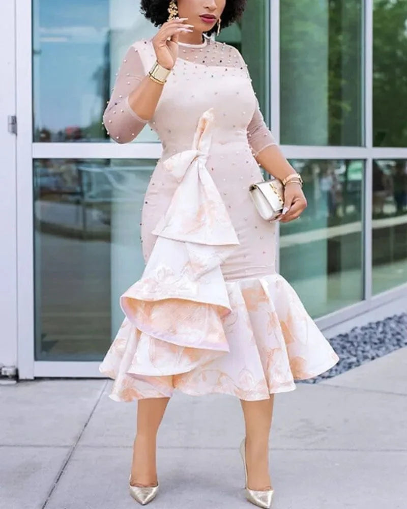Showlu Fashion long African dress with nail-beaded mesh sleeves, ruffles, and elegant design for evening parties and special occasions.