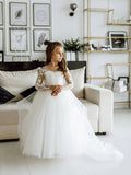 Long-sleeve lace flower girl dress in white with a ball gown style, featuring intricate lace details for special occasions.