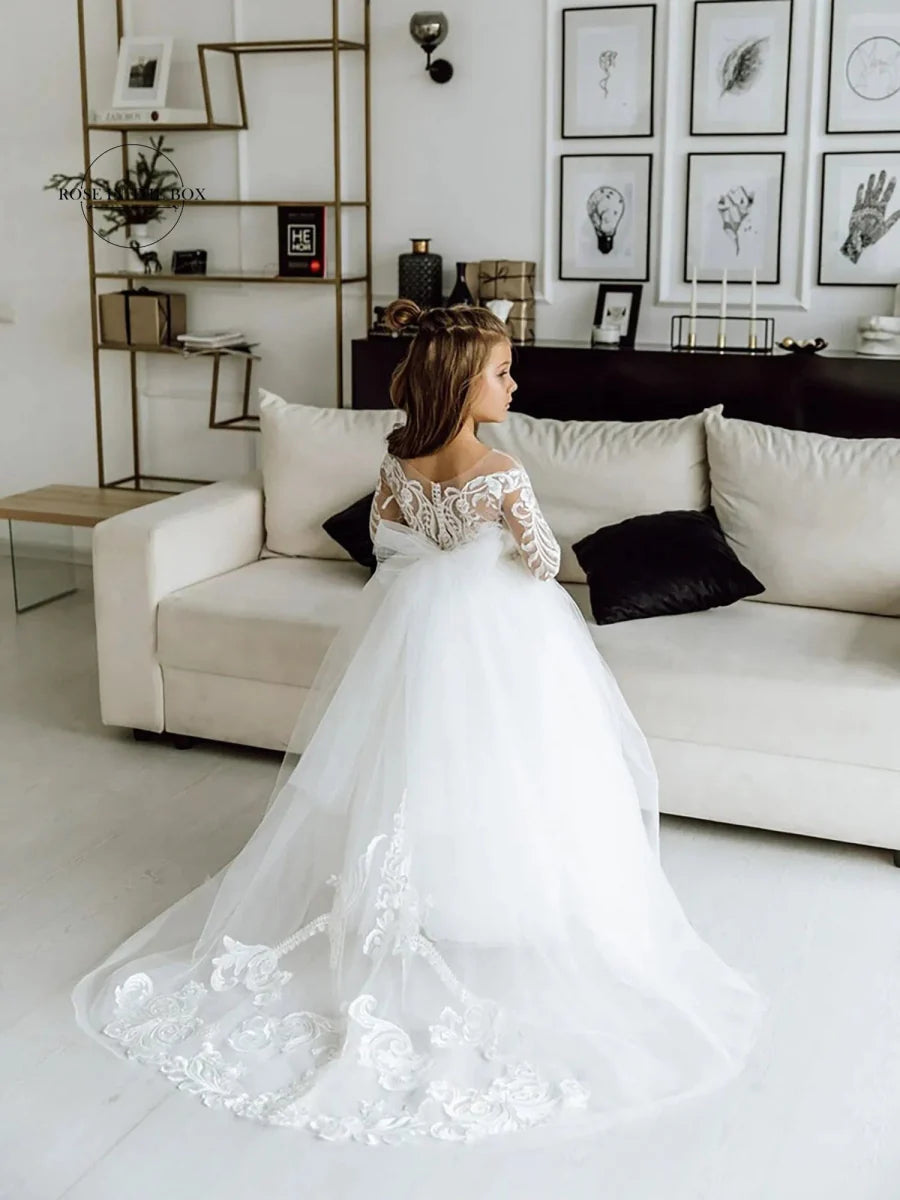 White long-sleeve lace flower girl dress by Showlu Fashion Store, ball gown style with intricate lace details for special occasions.