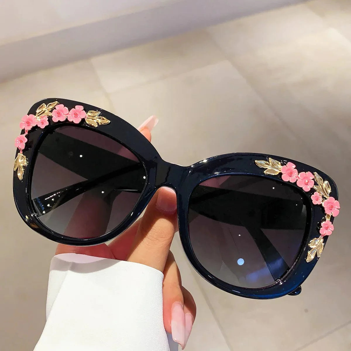 Buyuteen women's oversized cat eye sunglasses with pink vintage frames, UV400 protection, trendy floral design, and bold fashion style.