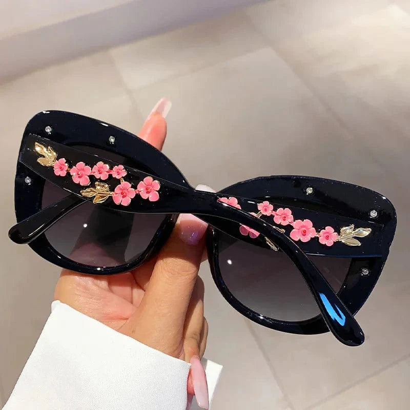 Buyuteen women's oversized cat eye sunglasses with pink frames, vintage UV400 lenses, trendy fashion accessory for women.