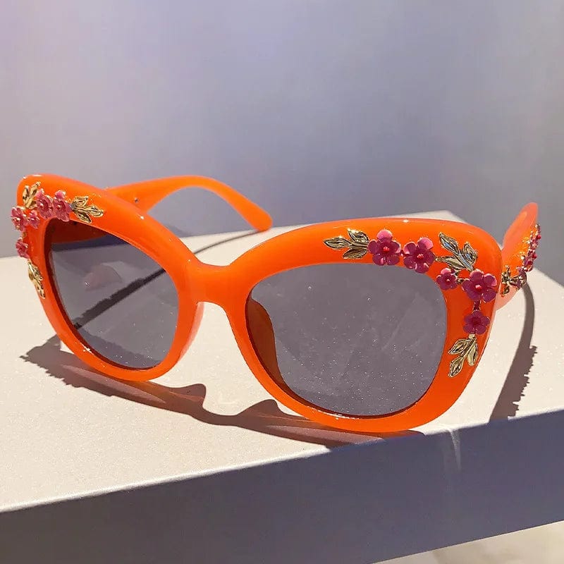 Buyuteen women's oversized cat eye sunglasses with vintage pink frames, UV400 protection, trendy punk style, and floral design.