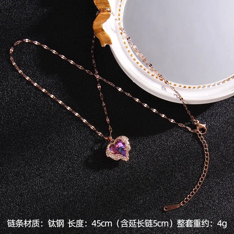 Colorful crystal ocean heart pendant necklace for women, stainless steel jewelry with a vibrant, luxurious design.