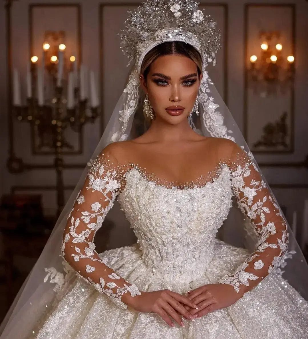 Vinca Sunny Lace Ball Gown wedding dress by Showlu Fashion with long sleeves, tulle fabric, sequins, beads, and sheer neckline.