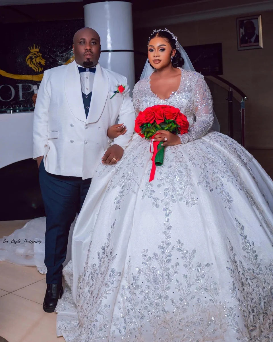 Luxury Vinca Sunny ball gown wedding dress by Showlu Fashion with lace, long sleeves, satin fabric, and beaded detailing.
