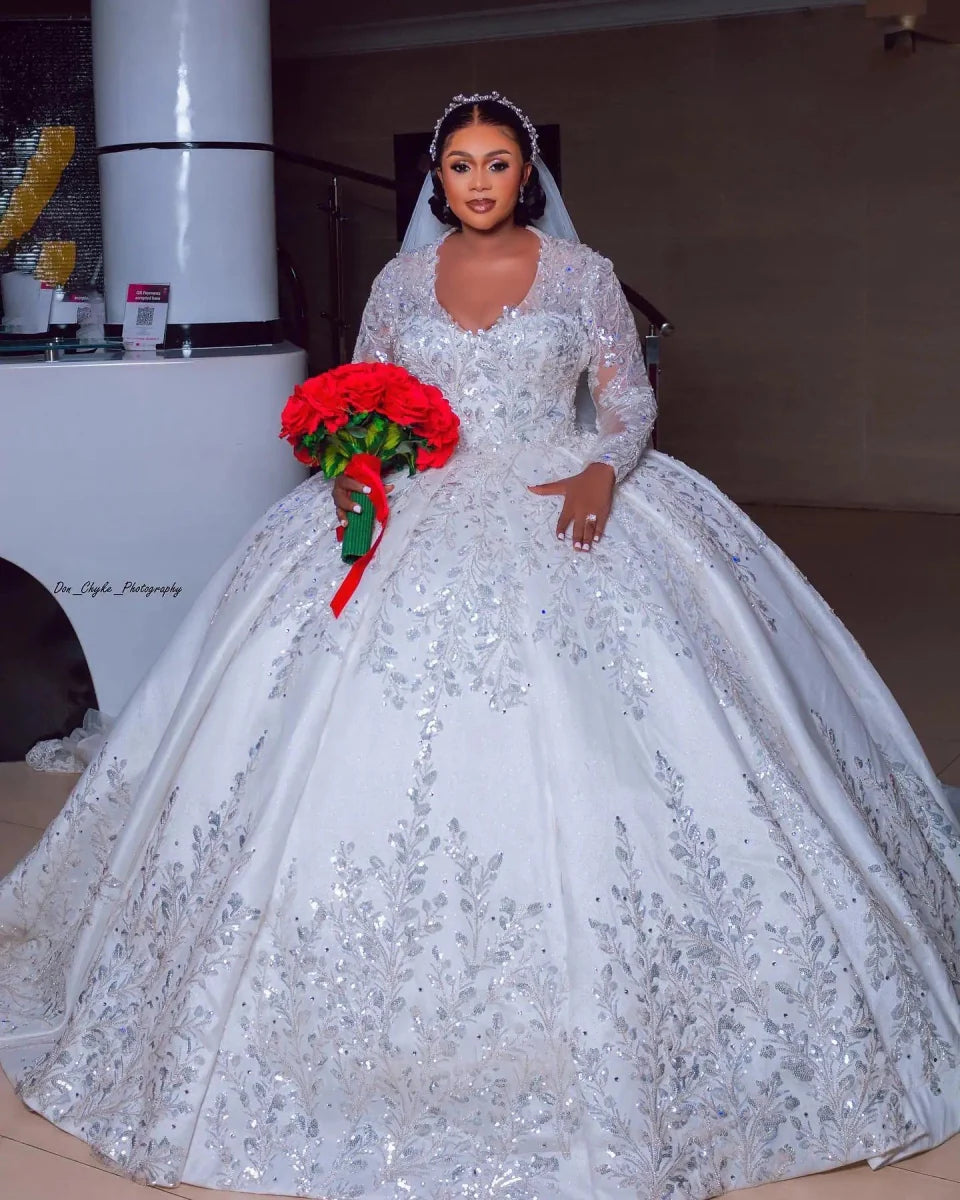 Vinca Sunny luxury ball gown wedding dress with lace, long sleeves, satin fabric, beaded details, and custom fit for plus-size brides