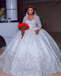 Vinca Sunny luxury ball gown wedding dress with lace, long sleeves, satin fabric, beaded details, and custom fit for plus-size brides