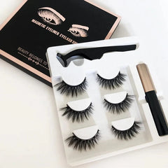 A magnetic eyelash kit containing three pairs of lashes, an applicator tool, and eyeliner.