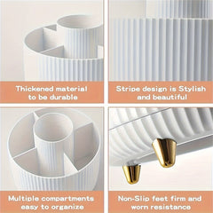 A white, circular, rotating makeup organizer with five compartments and gold-toned feet.