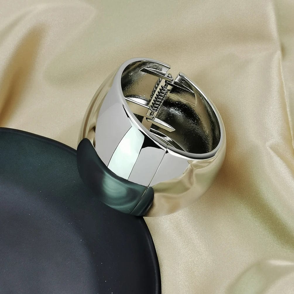 Wide gold alloy cuff bangle for women, statement punk jewelry with shiny surface, bold bracelet fashion accessory.