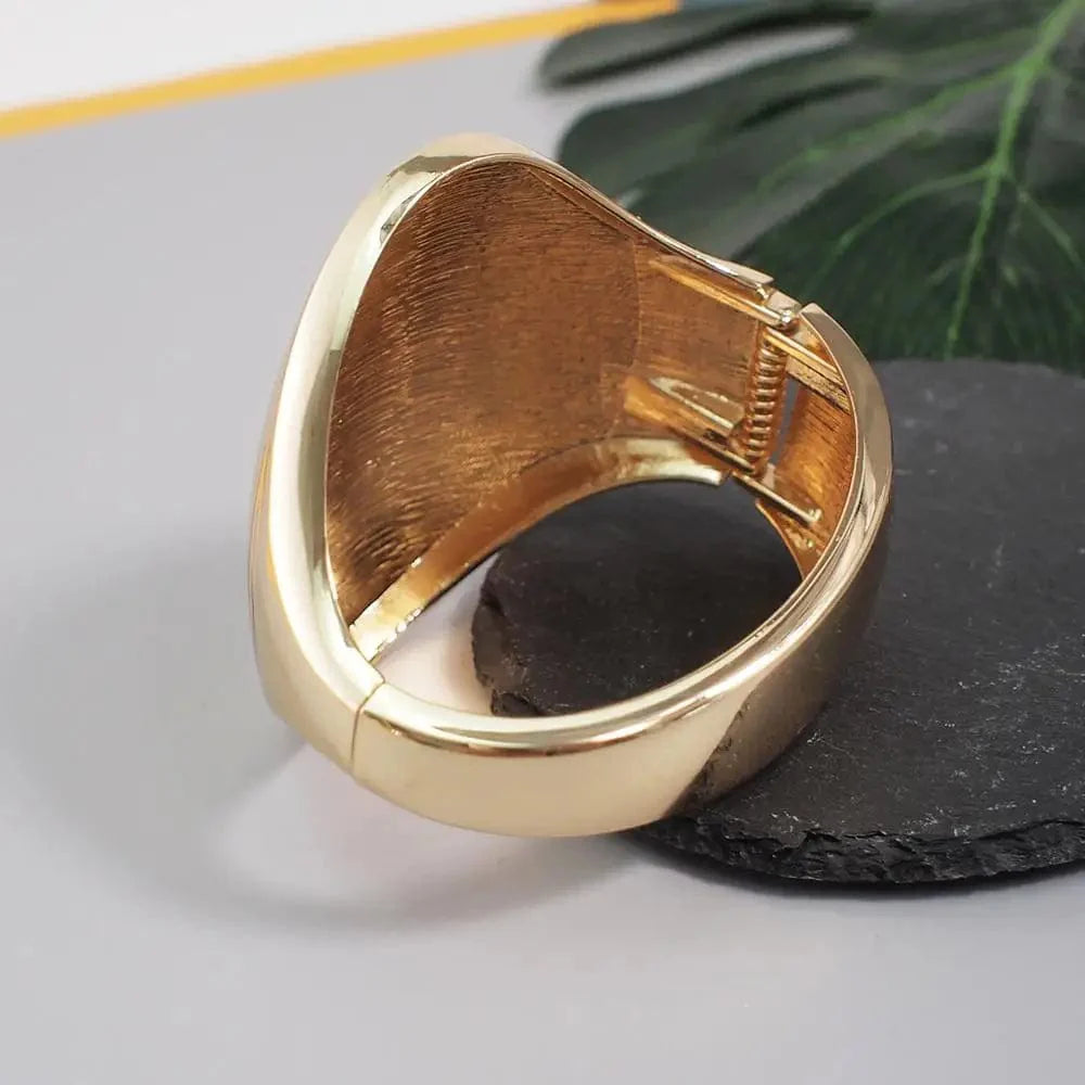Shiny alloy cuff bangle with geometric design, bold statement bracelet for women, featuring a punk-inspired style.