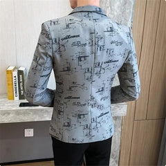 A slim-fit grey men's blazer featuring an all-over black abstract print and text pattern.