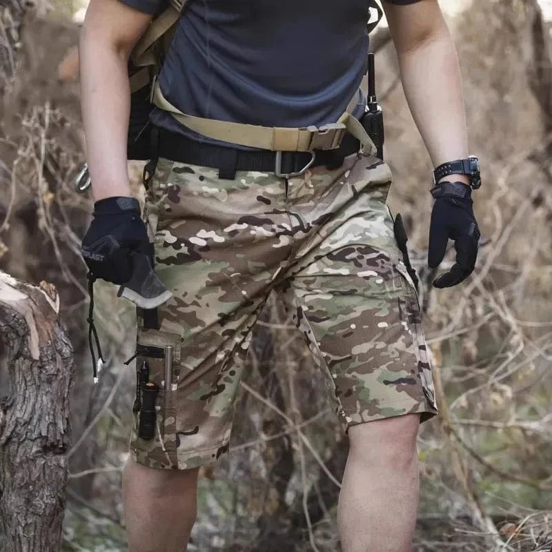 Men's tactical cargo shorts in waterproof camo ripstop fabric, featuring multiple pockets for outdoor hiking and rugged outdoor use.