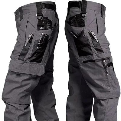 Men's SHOWLU tactical cargo shorts in waterproof camo ripstop fabric with multiple pockets, suitable for hiking and outdoor activities.