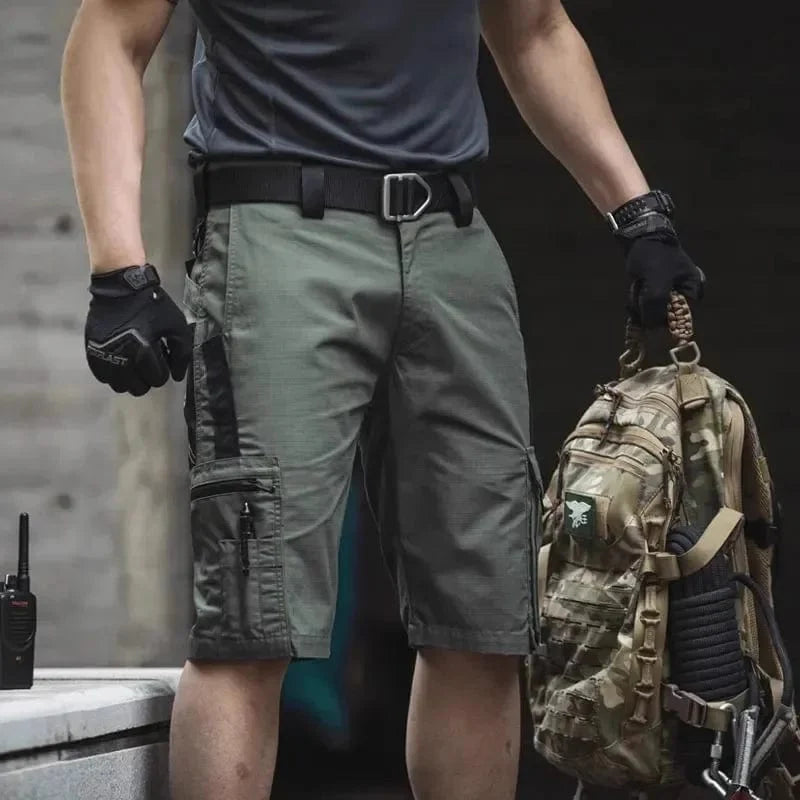 SHOWLU Men's tactical cargo shorts in camouflage ripstop fabric with multiple pockets, suitable for hiking and outdoor activities.