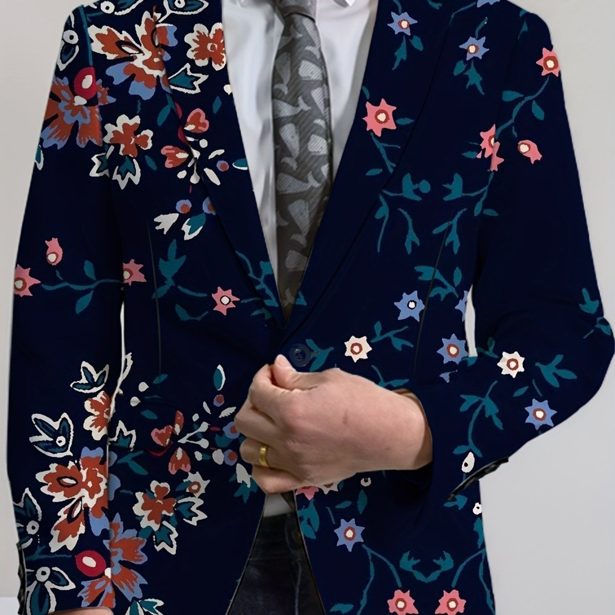 Men's navy blue floral print blazer by SHOWLU FASHION STORE, woven two-button jacket with vibrant red, white, and blue flowers.