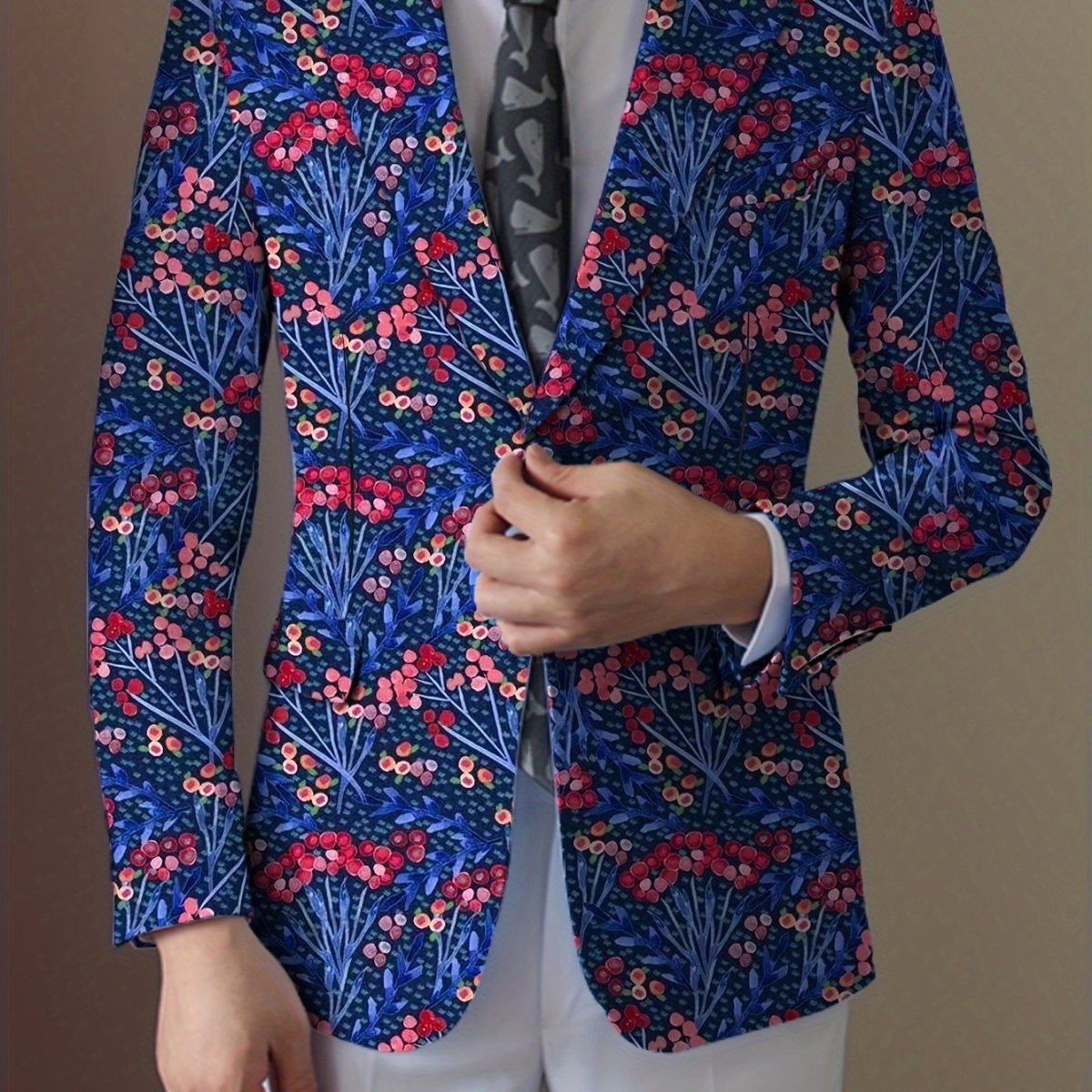 Men's navy blue floral print blazer with two buttons, featuring vibrant red, white, and blue flowers, stylish for casual or formal wear.