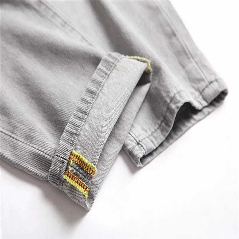 Men's light gray ripped straight-leg jeans by Showlu Fashion, full-length denim trousers with distressed details for spring and autumn.