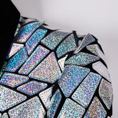 A close-up of a men's blazer featuring a mosaic of shimmering, holographic silver mirror tiles.