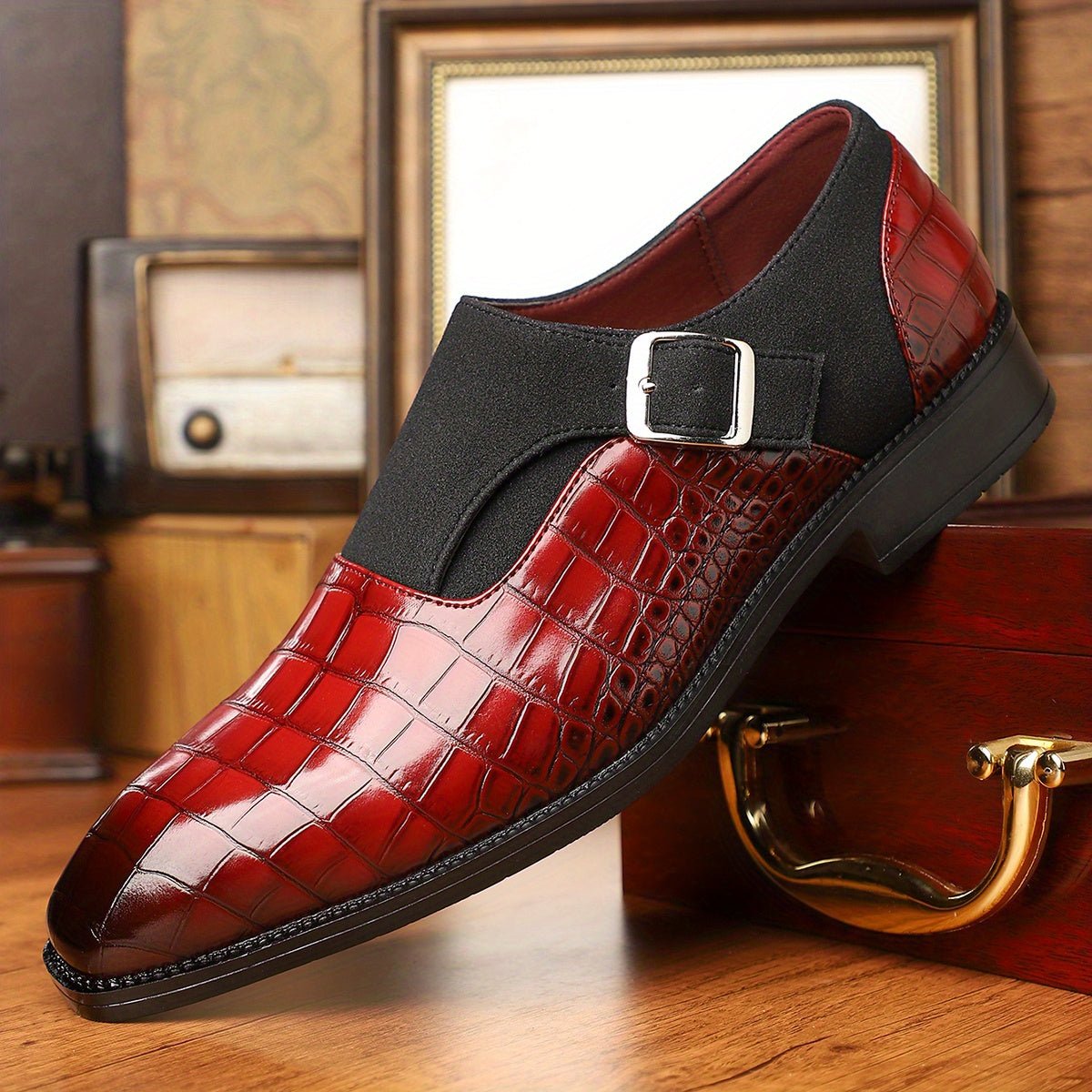 Men's navy blue monk strap shoes with crocodile pattern, pointed toe, adjustable buckle, slip-on design, suitable for formal occasions.