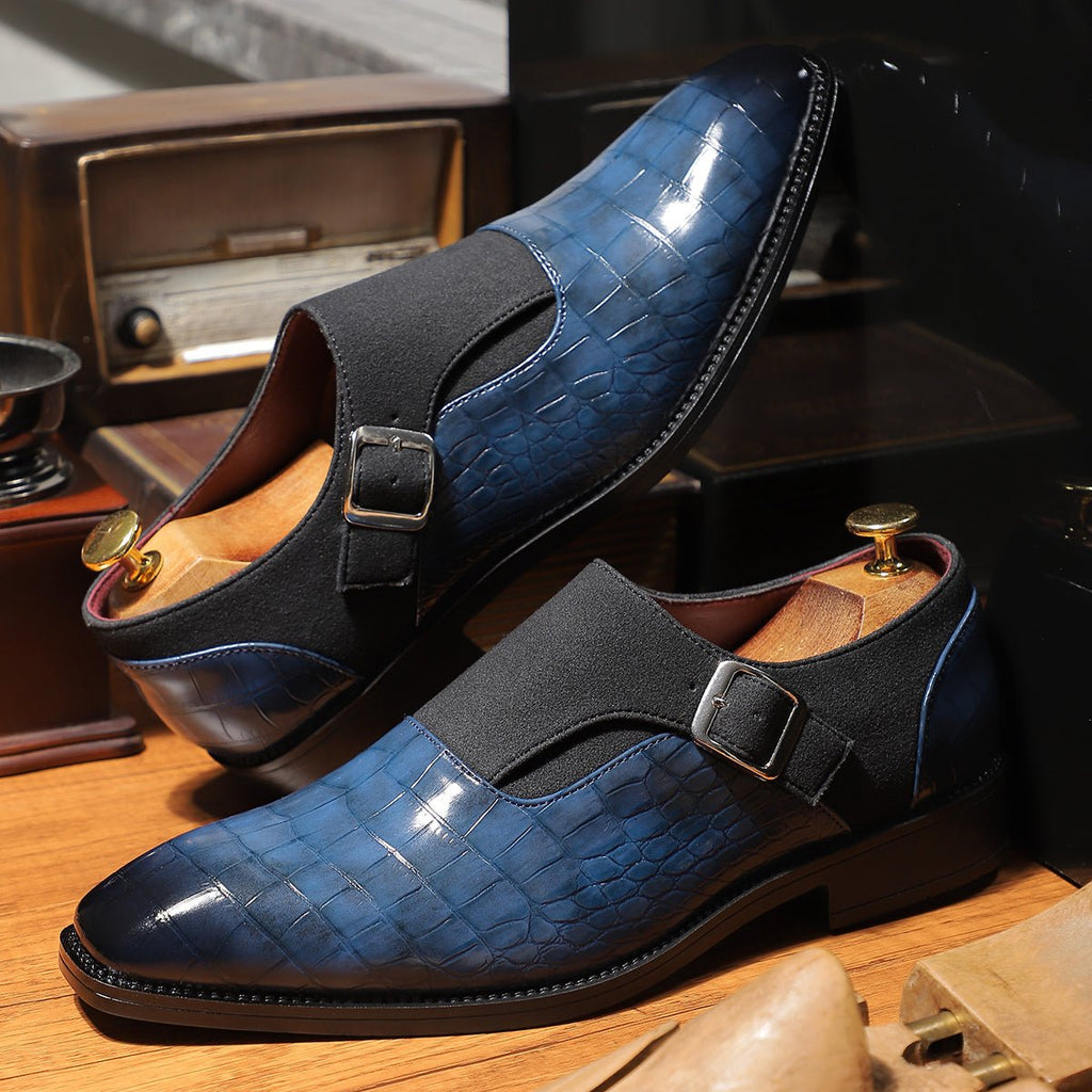 Men's navy blue monk strap shoes with pointed toes and crocodile pattern, featuring adjustable buckles and slip-resistant soles.