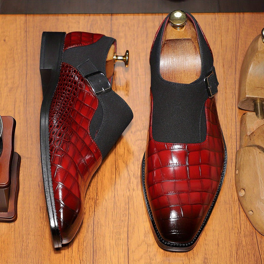 Men's navy blue monk strap shoes with crocodile pattern, pointed toe, adjustable buckle, slip-on design, for formal and business wear.