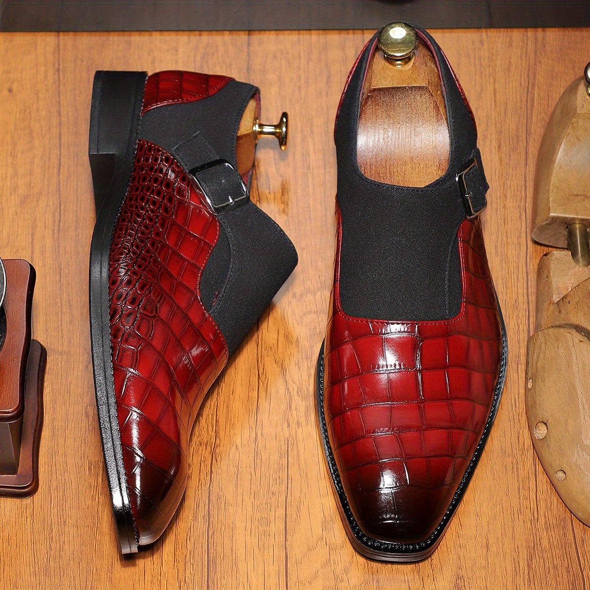 Men's navy blue monk strap shoes with crocodile pattern, pointed toe, adjustable buckle, slip-on design, for formal and business wear.