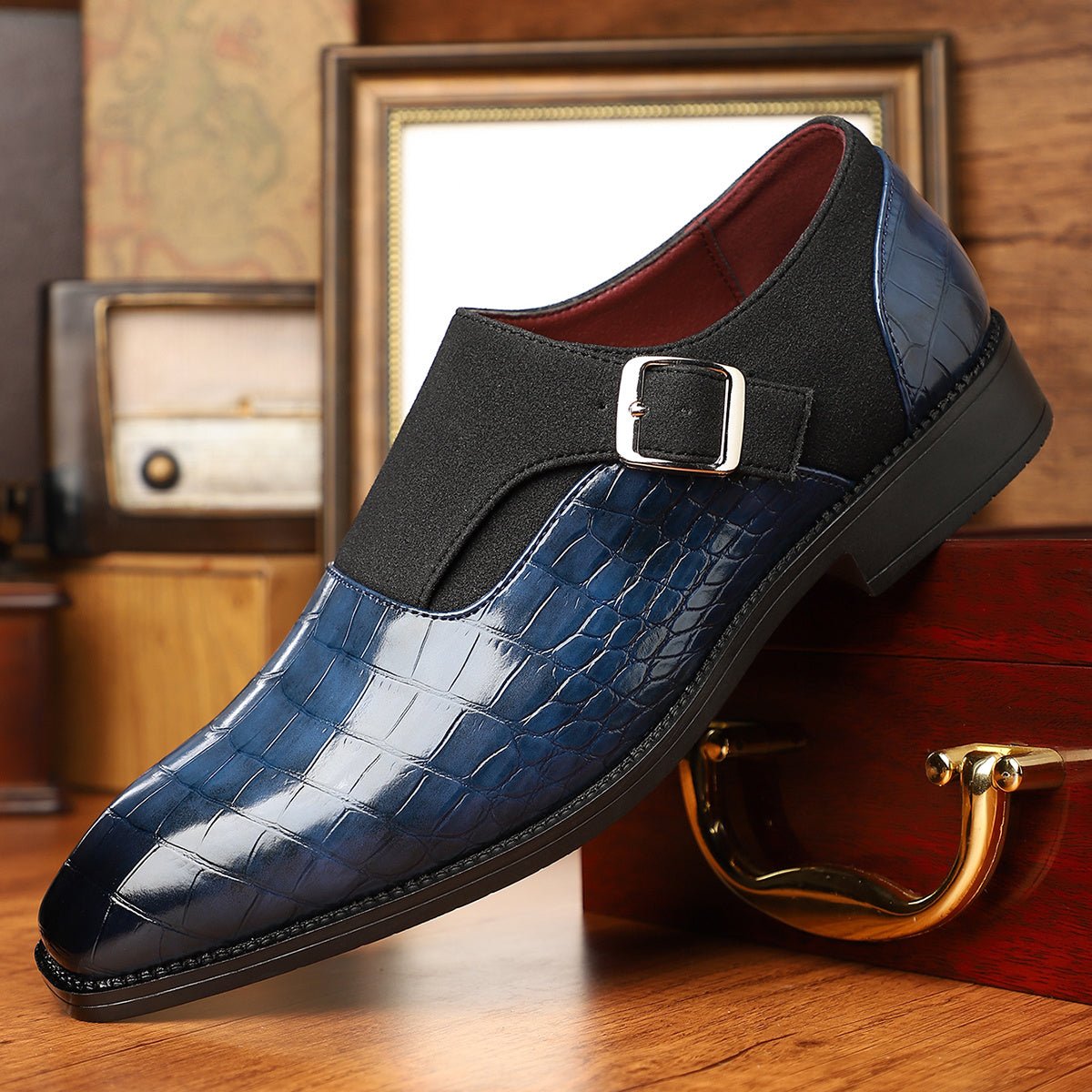 Men's navy blue monk strap shoes with pointed toe and crocodile pattern, featuring adjustable buckle straps and a non-slip sole.
