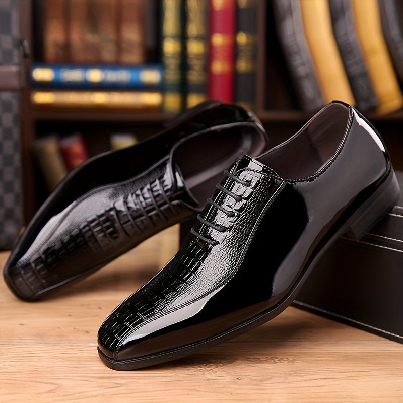 Men's black crocodile texture pointed toe lace-up dress shoes with rubber sole, suitable for formal, business, or party attire.