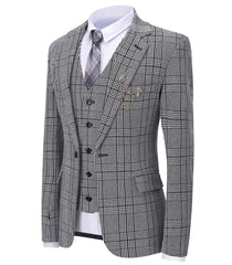 A grey plaid three-piece suit featuring a blazer, vest, and a white shirt with a patterned tie.