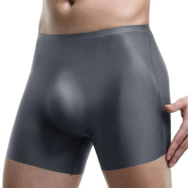 Showlu Men's Ice Silk Seamless Boxer Shorts with 3D Pouch, solid slim fit men's underwear in black, front view.