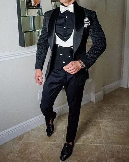 Black men's Italian design 3-piece wedding tuxedo suit with skinny fit, including jacket, vest, and pants, ideal for formal occasions.