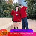 Young adult man and woman wearing Showlu Fashion men's V-neck Christmas pullovers, celebrating the holiday season together.