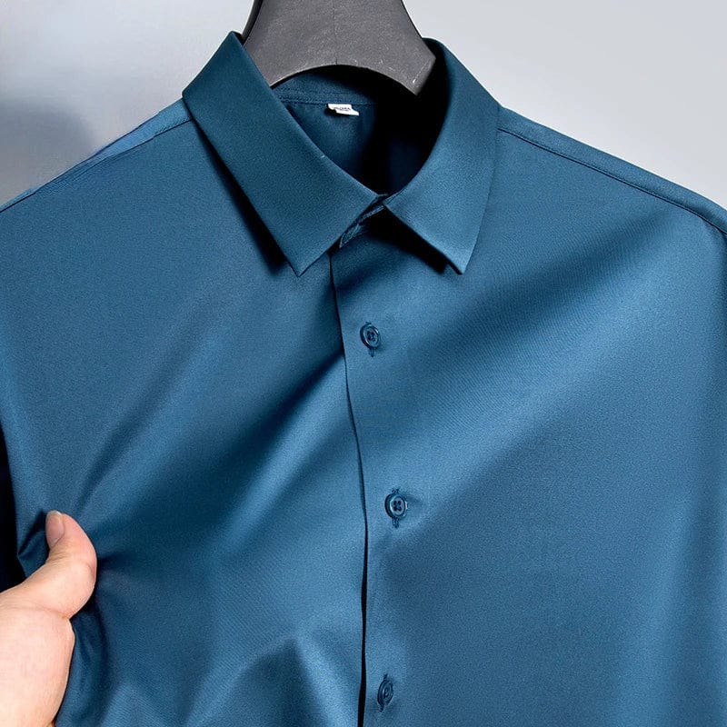 SHOWLU men's slim fit long sleeve work shirt in micro elastic broadcloth, featuring a casual yet formal white, black, or blue design.