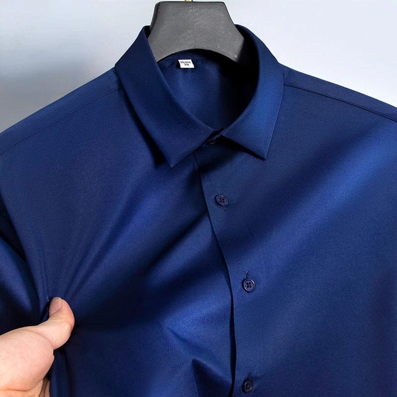 SHOWLU men's slim fit long sleeve work shirt in white, black, or blue, made of micro-elastic broadcloth for casual or formal wear.