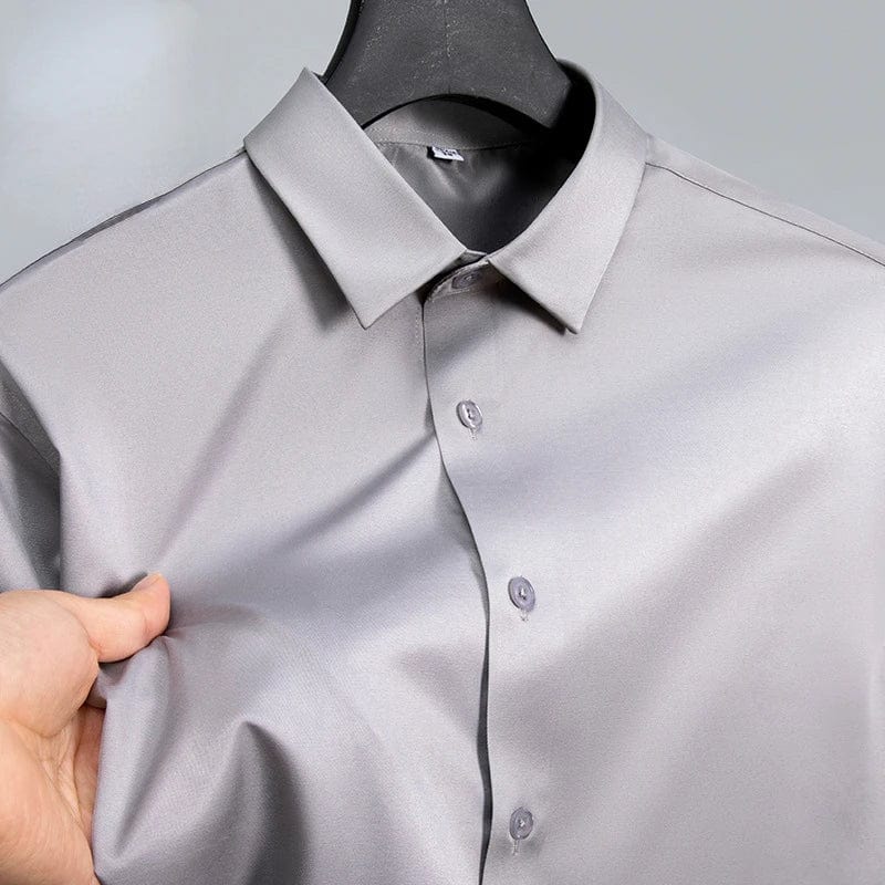 Men's slim fit long sleeve work shirt by SHOWLU FASHION STORE, made of micro elastic broadcloth in white, black, or blue.