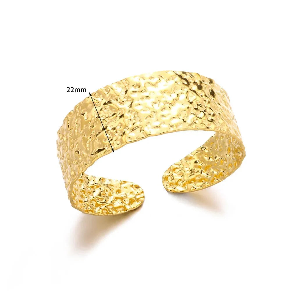 Minimalist stainless steel cuff bracelet in vintage gold finish, designed for women, featuring textured aesthetic charm for daily wear.