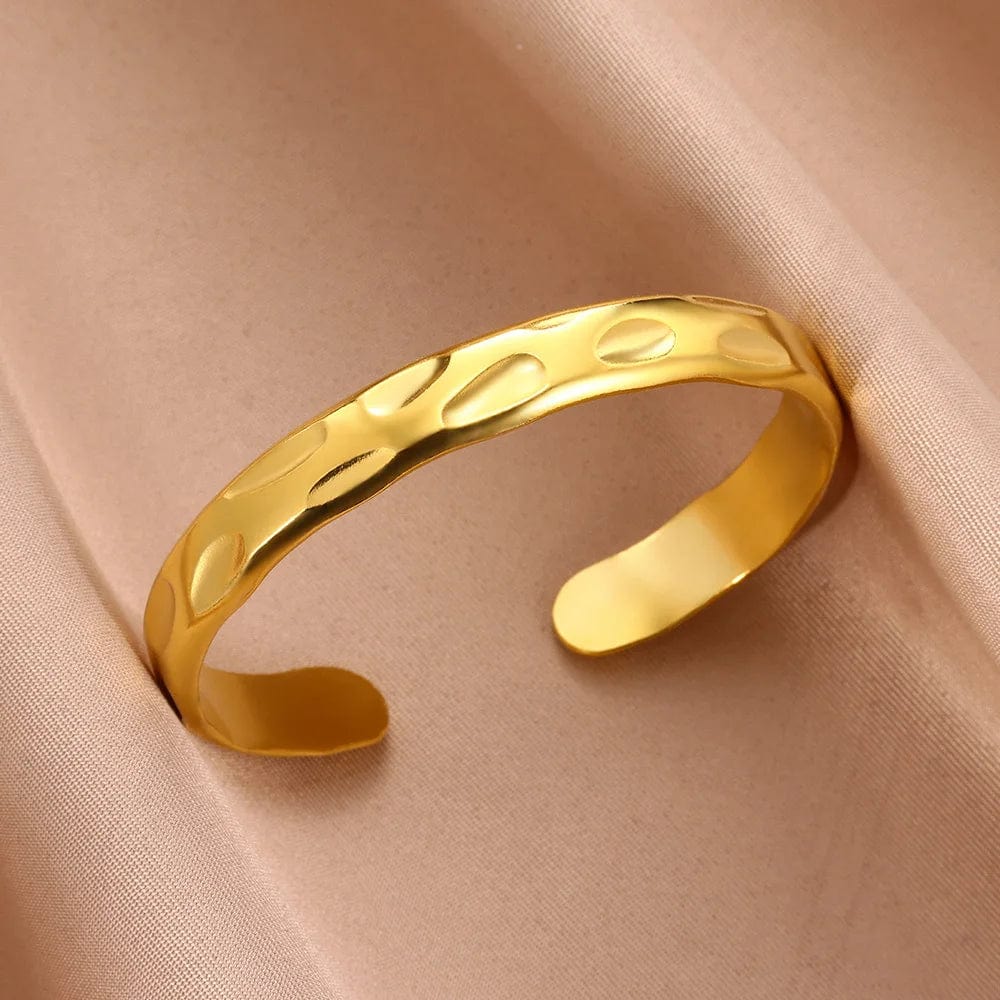 Minimalist stainless steel cuff bracelet in vintage gold for women, featuring textured charm design for everyday wear.