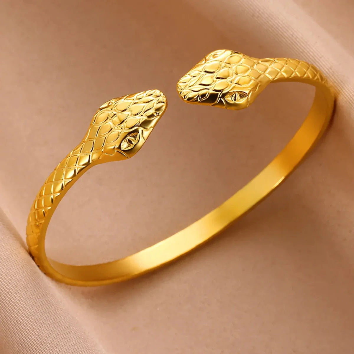 Minimalist stainless steel cuff bracelet in vintage gold, featuring textured design for women’s daily wear jewelry style.