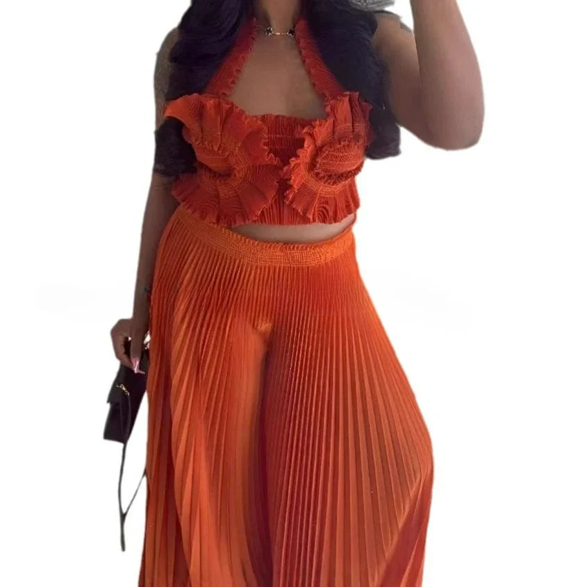 Miyake Pleated Two Piece Set with sexy V-neck top and wide-leg pants, in a solid color, stylish women's outfit.